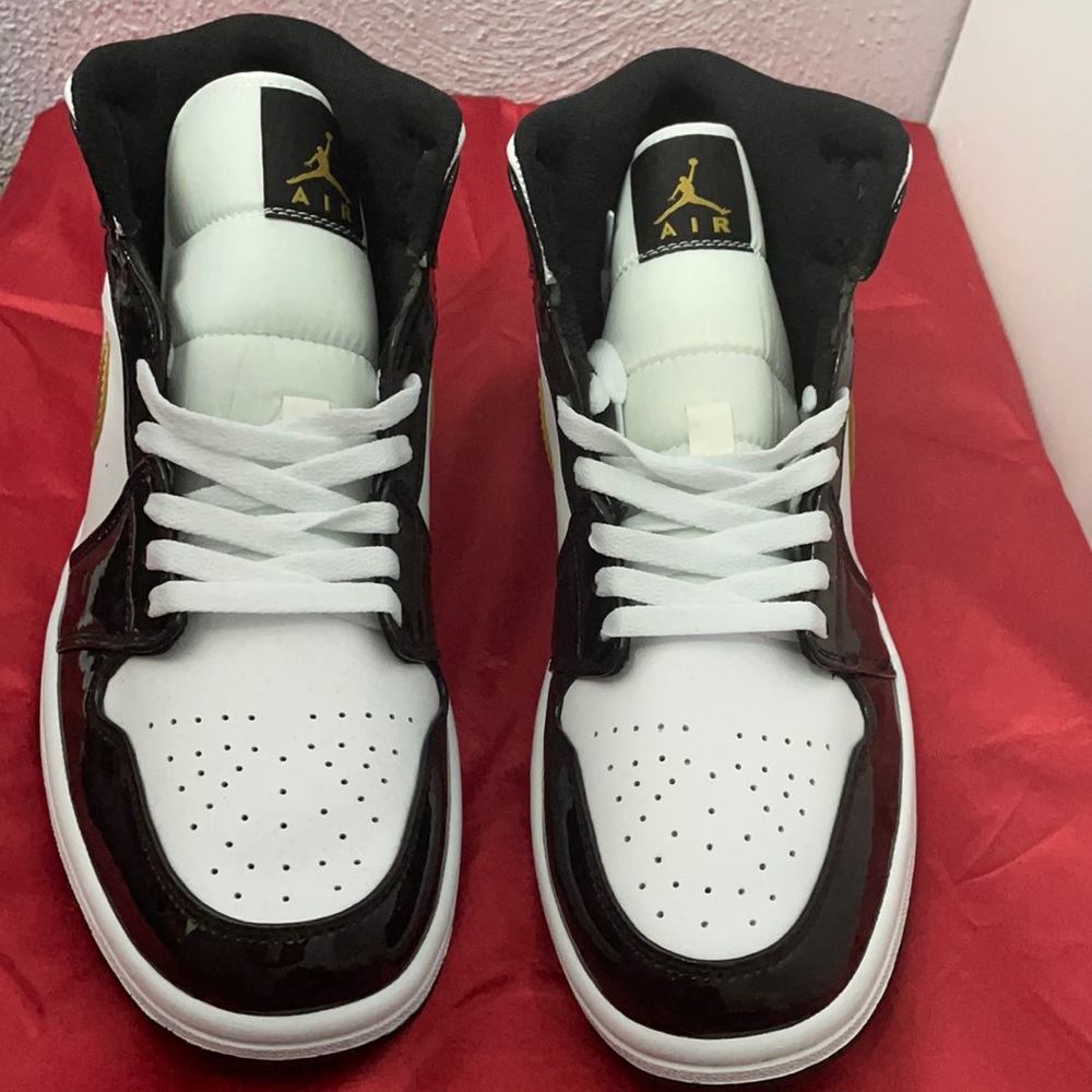 High top Jordan 1 black and gold